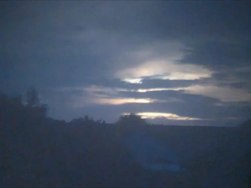 Projection of the sun behind clouds.