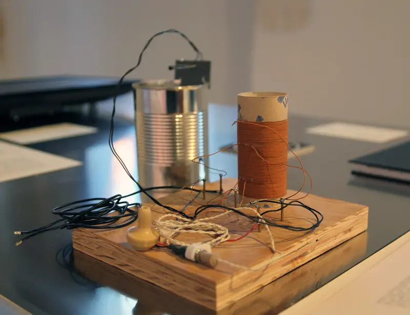 A modern-looking tin-can radio, which has clearly not been used by its pristine soot-less tin-can.