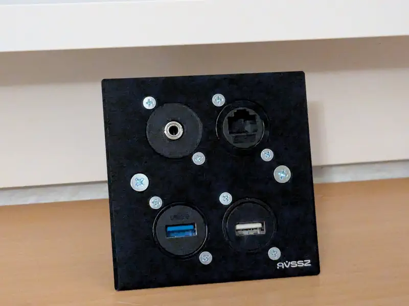 A d-series 4 port patch panel balancing under a window sill.